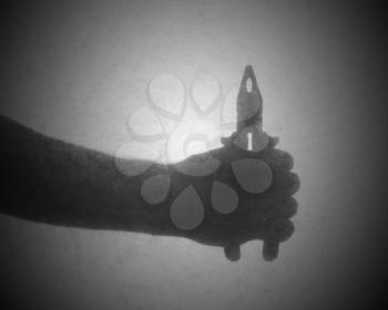 Silhouette behind a transparent paper - Small pliers