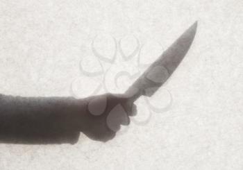 Silhouette behind a transparent paper - Knife threat