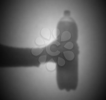 Silhouette behind a transparent paper - Blurred - Bottle of soda