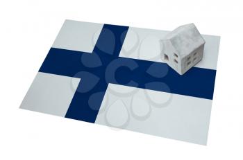 Small house on a flag - Living or migrating to Finland