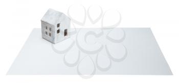 Small house on a white card, isoalted on white