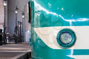 Closeup of a train headlight shining, vintage train