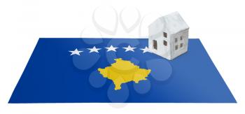 Small house on a flag - Living or migrating to Kosovo