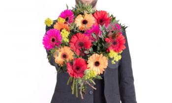 Man is giving flowers - Isolated on white