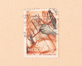 THE NETHERLANDS 1950: A stamp printed in the Netherlands shows someone playing the drums, circa 1950
