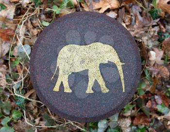 Elephant symbol on a pole in a forrest