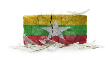 Brick with broken glass, violence concept, flag of Myanmar
