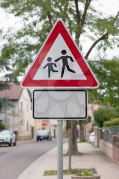 Attention children roadsign at the side of the road (Germany)