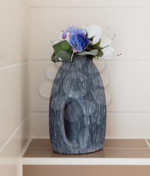 Flowers in a vase - Decoration in a toilet