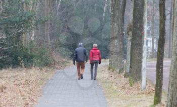 Unrecognisable couple walking on a street in the Netherlands