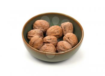 Wallnuts in a bowl, isolated on white