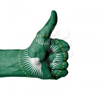 Closeup of male hand showing thumbs up sign, flag of the African Union