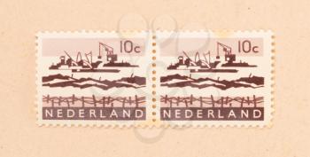 THE NETHERLANDS 1970: A stamp printed in the Netherlands shows the construction of the afsluitdijk, circa 1970