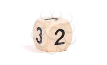 Small wooden dice, numbers written on it, isolated on white