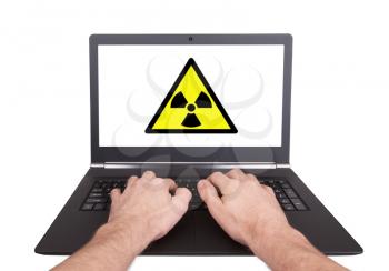 Man working on laptop, radiation, isolated
