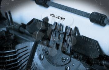 Close-up of an old typewriter with paper, perspective, selective focus, coaching