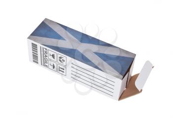 Concept of export, opened paper box - Product of Scotland