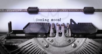 Vintage inscription made by old typewriter, coming soon