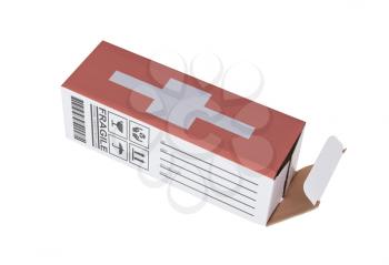 Concept of export, opened paper box - Product of Switzerland