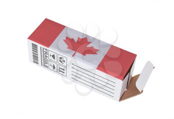Concept of export, opened paper box - Product of Canada