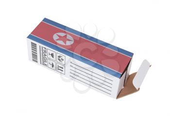 Concept of export, opened paper box - Product of North Korea