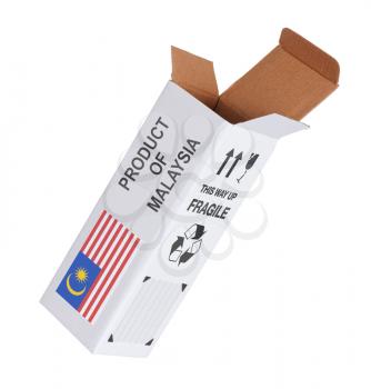Concept of export, opened paper box - Product of Malaysia