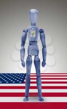 Old wood figure mannequin with US state flag bodypaint - New York