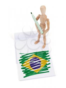 Wooden mannequin made a drawing of a flag - Brazil