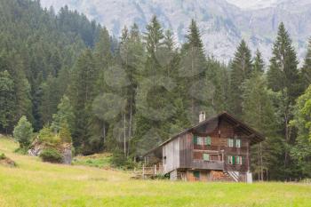 Typical house in the Swiss alps, rough country