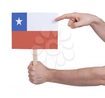 Hand holding small card, isolated on white - Flag of Chile