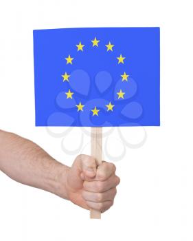Hand holding small card, isolated on white - Flag of the European Union