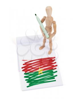 Wooden mannequin made a drawing of a flag - Burkina Faso