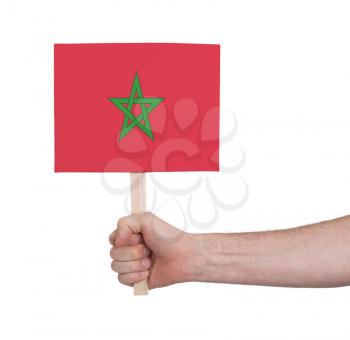 Hand holding small card, isolated on white - Flag of Morocco