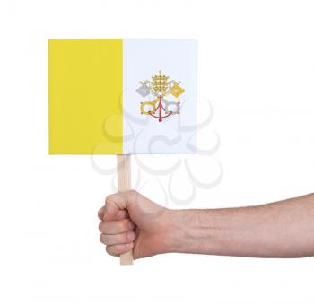 Hand holding small card, isolated on white - Flag of Vatican City