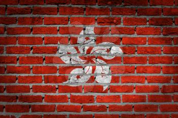 Dark brick wall texture - flag painted on wall - Hong Kong