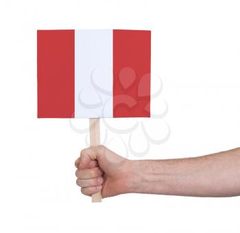 Hand holding small card, isolated on white - Flag of Peru