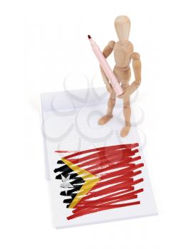 Wooden mannequin made a drawing of a flag - East Timor
