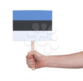 Hand holding small card, isolated on white - Flag of Estonia