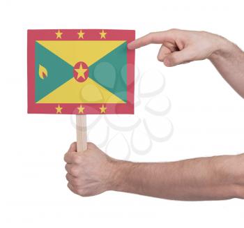 Hand holding small card, isolated on white - Flag of Grenada
