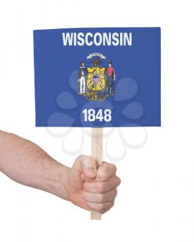 Hand holding small card, isolated on white - Flag of Wisconsin