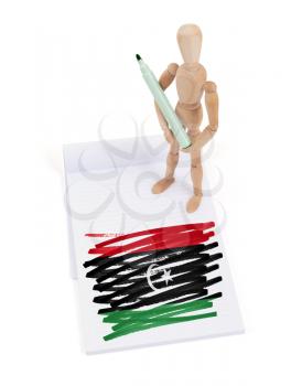 Wooden mannequin made a drawing of a flag - Libya