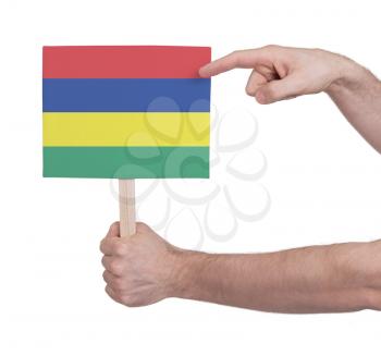 Hand holding small card, isolated on white - Flag of Mauritius