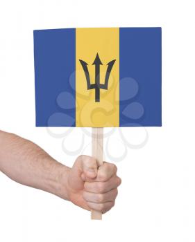 Hand holding small card, isolated on white - Flag of Barbados