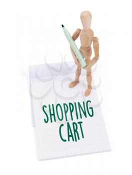 Wooden mannequin writing in a scrapbook - Shopping cart
