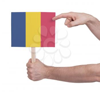 Hand holding small card, isolated on white - Flag of Romania