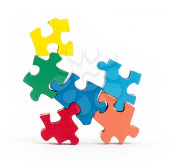 Closeup of big jigsaw puzzle pieces isolated on white