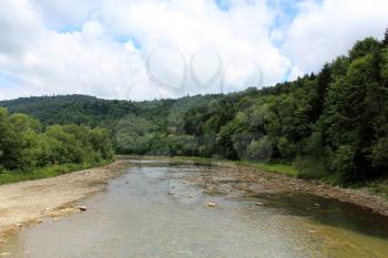 beautiful landscape with speed water in mountainous river