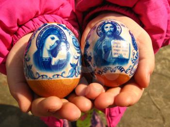Two easter eggs in the hands of the girl