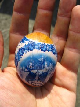 image of Easter egg with drawing in the hand