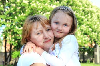 image of mother and daughter are hugging one another